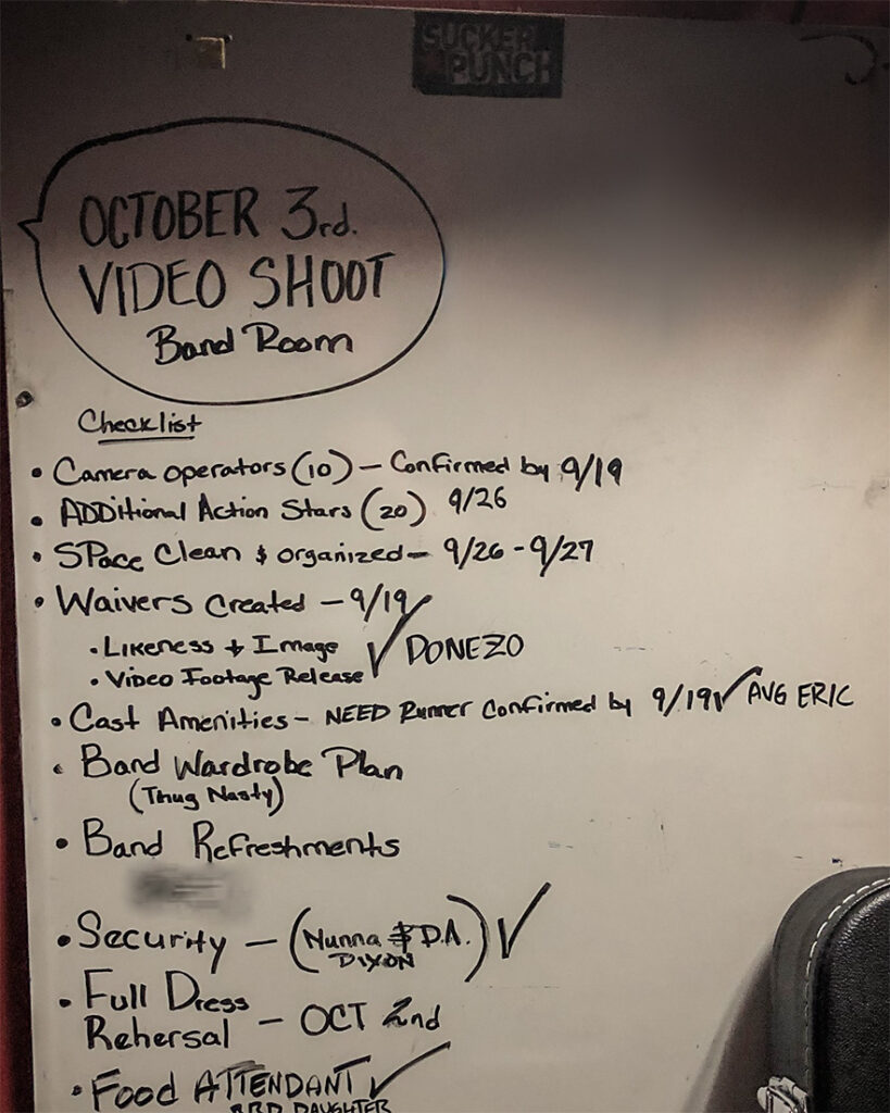 a white marker board with a preparation checklist for a video shoot